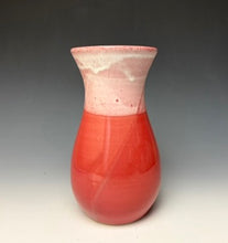 Load image into Gallery viewer, a red vase with white, foamy looking, area along the top 1/3 of the vase. The vase is pictured on a grey gradient background.