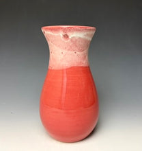Load image into Gallery viewer, a red vase with white, foamy looking, area along the top 1/3 of the vase. The vase is pictured on a grey gradient background.