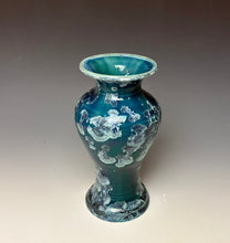 Load image into Gallery viewer, A small ceramic vase with a flared rim, featuring a glossy teal and blue crystalline glaze with white cloud-like zinc crystals, photographed against a neutral gray studio background.
