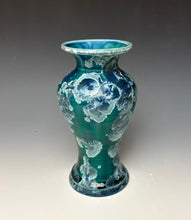 Load image into Gallery viewer, A vintage-style ceramic vase with a flared rim and footed base, featuring a glossy teal and green body with white marbled floral patterns and a blue glazed interior, photographed against a neutral gray gradient background.
