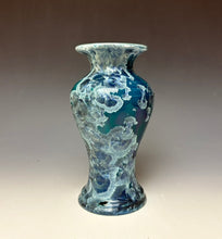 Load image into Gallery viewer, A ceramic vase with a flared rim and bulbous body, featuring a mottled blue and white glaze with organic, cloud-like patterns, set against a neutral gradient background.
