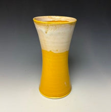 Load image into Gallery viewer, a yellow vase with light white, foamy looking, area along the top 1/3 of the vase. The vase is pictured on a grey gradient background.
