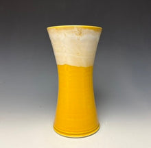 Load image into Gallery viewer, a yellow vase with light white, foamy looking, area along the top 1/3 of the vase. The vase is pictured on a grey gradient background.

